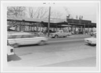Photograph of a car driving by the construction site for the the new library, Athens, Georgia, circa 1969