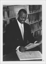 Photograph of a man reading the Wall Street Journal at the Athens-Clarke County Library, Athens, Georgia, circa 1995