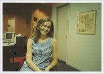 Photograph of a woman sitting in the Athens-Clarke County Library's office space, Athens, Georgia, circa 1995