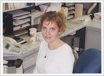 Photograph of a woman at her desk at the Athens-Clarke County Library, Athens, Georgia, circa 1995