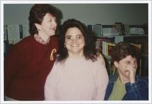 Photograph of Athens-Clarke County Library employees having a laugh at work, Athens, Georgia, circa 1995