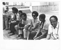 Group Sitting on a Bench, circa 1972