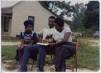 People seated outside, circa 1975