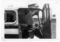 Two Young Men Stand in a Bus Doorway, circa 1950