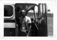 Two Men Stand in a Bus Doorway, circa 1950