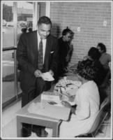 Joseph E. Lowery Holding a Booklet, circa 1965