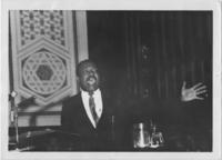 Martin Luther King, Jr. Speaks at a Podium, circa 1965