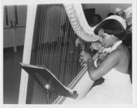 Fredreka Coleman Playing a Harp at the Calhoun County SCLC Chapter's Annual Awards Banquet, July 1981