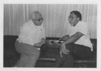 Joseph E. Lowery and Caesar Jerez Seated on a Couch Talking, November 1986