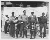 Drum Major For Justice Amateur Golf Tournament Winners Pose With Their Trophies, April 1984