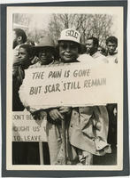 Women With Protest Signs Amongst Demonstrators, circa 1980