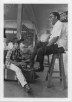 Joseph E. Lowery Getting His Shoes Shined by a Boy, November 1986