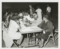 A Group of Unidentified People at a Table, circa 1965