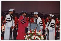 Four Men on Stage at Commencement, 1989