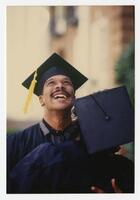 Two Graduates Embrace at Commencement, 1989