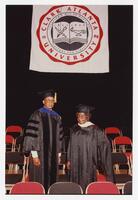 Herbert J. Miller and Unidentified Woman at Commencement at the Civic Center, 1991