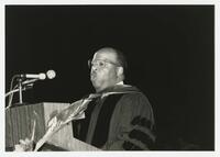 An Unidentified Man on Stage at Commencement, 1991