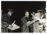 Three Unidentified Men on Stage at Commencement at the Civic Center, 1991