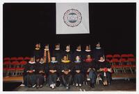 Fourteen Unidentified Men and Women on Stage at Commencement, 1992