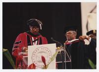 Thomas W. Cole, Jr. and an Unidentified Man on Stage at Commencement, 1994
