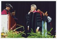 Thomas W. Cole, Jr. and an Unidentified Man on Stage at Commencement, 1998