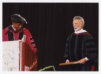 Thomas W. Cole, Jr. and an Unidentified Man on Stage at Commencement, 1998