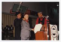 Thomas W. Cole, Jr. and Two Unidentified Men on Stage at Convocation, 1996