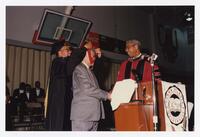 Thomas W. Cole, Jr. and Two Unidentified Men on Stage at Convocation, 1996