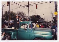 An Unidentified Man and Woman in a Pickup Truck in the Homecoming Parade, 1990
