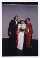 Group Portrait of Dr. Thomas W. Cole, Jr., Brenda Cole and an Unidentified Young Woman at Homecoming Activity, 1999