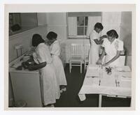 Four Unidentified Women in the Home Economics Department, Food Laboratory, E.D. Thayer Hall, 1955