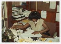 An Unidentified Staff Member at a Desk, circa 1980