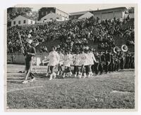 The Clark College Majorettes and Marching Band at a Football Game, circa 1960