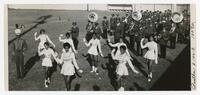 The Clark College Majorettes and Marching Band at a Football Game, circa 1960
