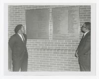 Three Unidentified Men with Plaques at the Alumni Association Gift Presentation, December 31, 1969