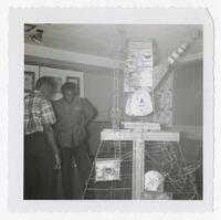 Two Unidentified Men With a Sculpture at an Art Exhibit, circa 1965
