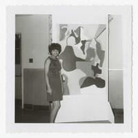An Unidentified Woman with a Painting at an Art Exhibit, circa 1965