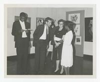 Two Unidentified Men and Two Unidentified Women at an Art Exhibit, circa 1965