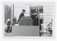 Vivian W. Henderson and an Unidentified Graduate on Stage at Commencement, circa 1965