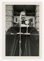 An Unidentified Man on Stage at Commencement, circa 1965