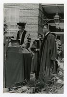 Vivian W. Henderson and an Unidentified Man at Commencement, circa 1970