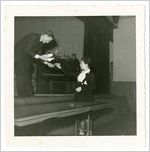 Photograph of a man and woman exchanging a gift on a stage, Clarkesville, Habersham County, Georgia.
