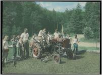 Photograph of children gathered around a tractor, Clarkesville, Habersham County, Georgia, 1950