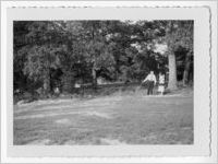 Photograph of a man and woman conversing on a lawn, Clarkesville, Habersham County, Georgia, 1953