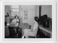 Photograph of two women and a young boy meeting in an office, Clarkesville, Habersham County, Georgia, 1953
