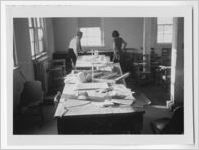 Photograph of a man and woman standing by work tables in a classroom, Clarkesville, Habersham County, Georgia, 1953