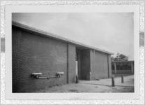 Photograph of drinking fountains mounted to the exterior of an unidentified building, Clarkesville, Habersham County, Georgia, 1953