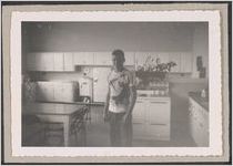Photograph of a boy standing inside a kitchen, Clarkesville, Habersham County, Georgia, 1953