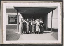 Photograph of people posed for a group portrait by the entrance of a building, Clarkesville, Habersham County, Georgia, 1950