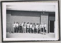 Photograph of a group of young people involved with a school cleanup campaign standing in front of a building, Clarkesville, Habersham County, Georgia, 1950